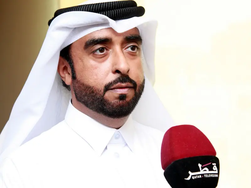 A participant speaking to a broadcaster’s microphone, 2024.