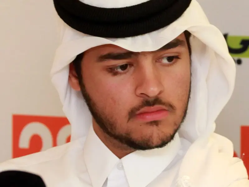 A participant speaking to a broadcaster’s microphone, 2024.