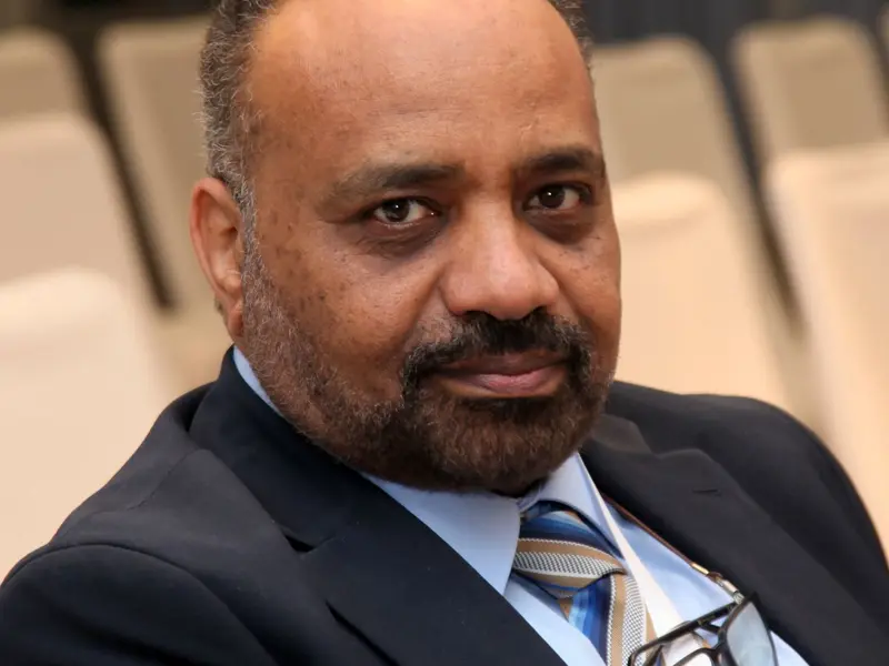 A speaker addressing the conference, 2025.