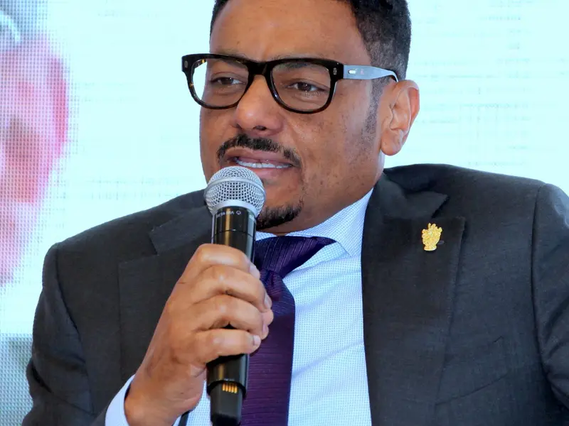 A speaker addressing the conference, 2025.