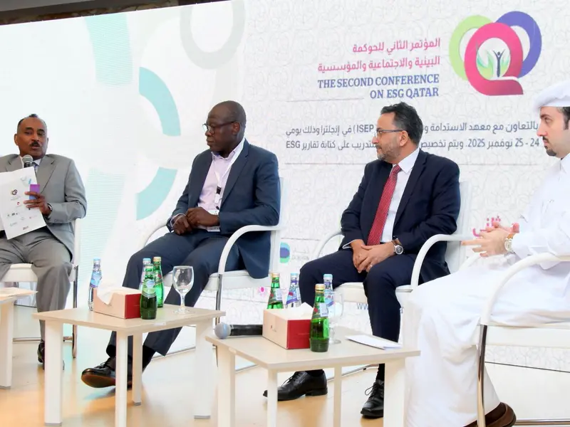 A panel of speakers seated on the conference stage, 2025.