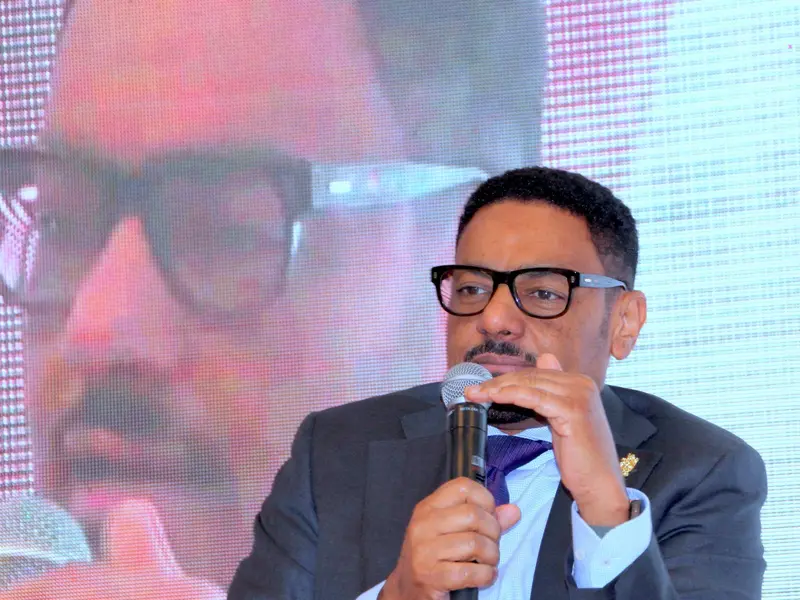 A speaker addressing the conference, 2025.