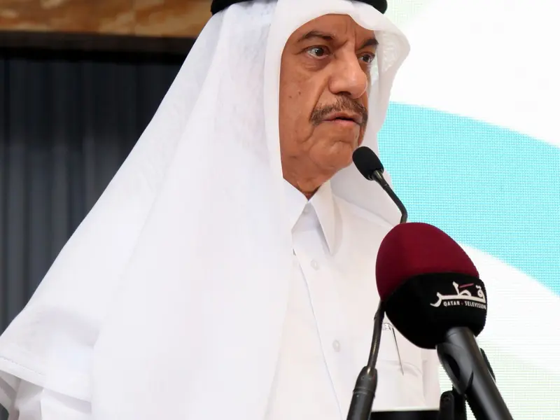 A speaker addressing the hall from the lectern, 2025.