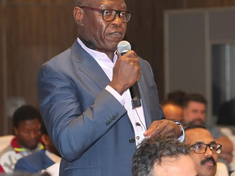 A speaker addressing the conference, 2025.