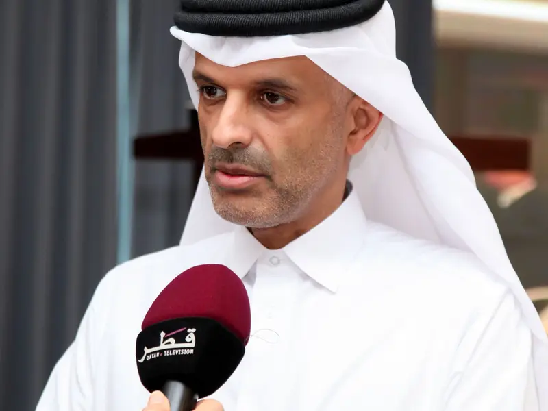 A participant speaking to a broadcaster’s microphone, 2025.