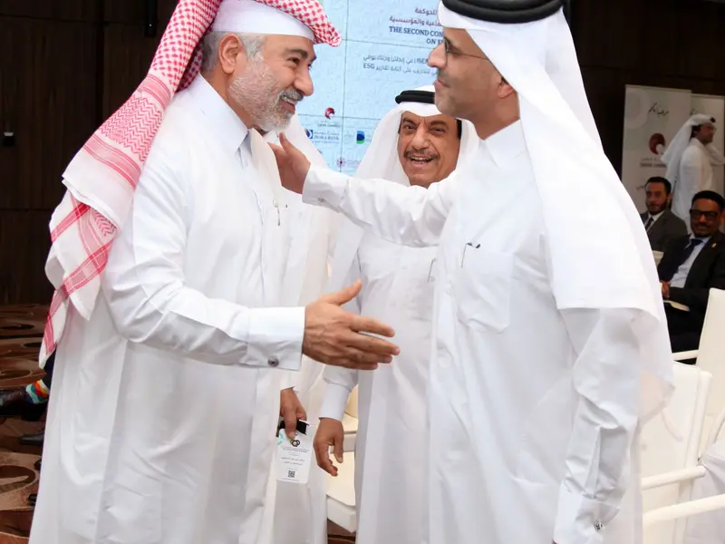 Delegates in conversation at the conference, 2025.