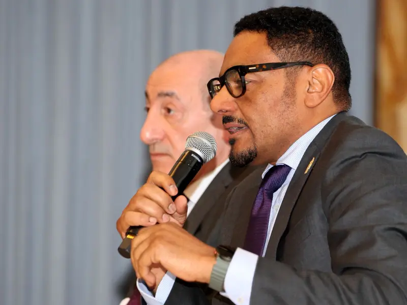 A speaker addressing the conference, 2025.