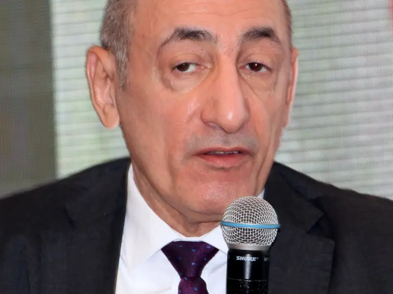 A speaker addressing the conference, 2025.