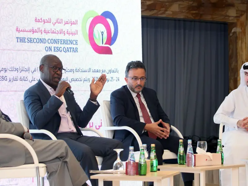 A panel of speakers seated on the conference stage, 2025.
